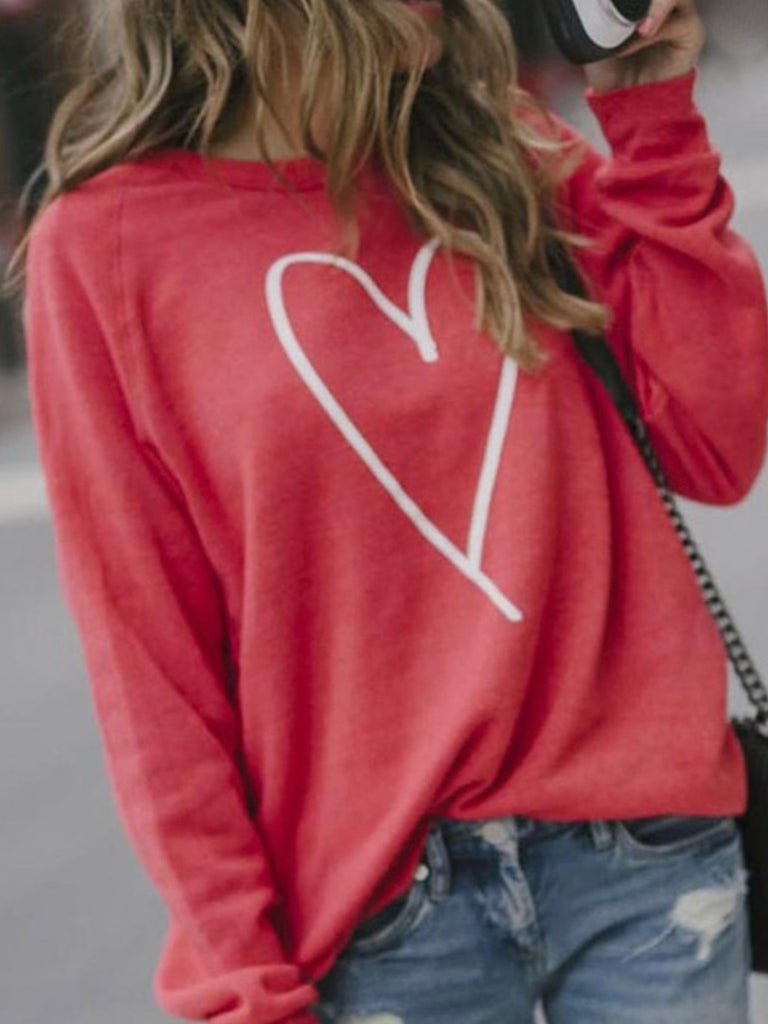 Red Heart Sweatshirt - Cozy romance in heather-red with a beautiful white heart graphic. 