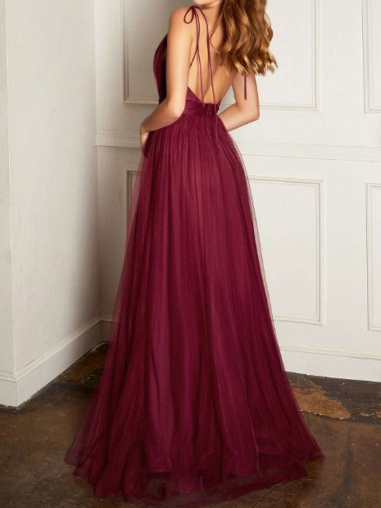 Beautiful Burgundy Dress with adjustable neck tie that allows for a personalized fit. The low back detail adds a hint of drama.