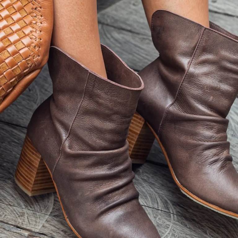 Brown leather ankle boots with ruched detail and stacked heel. Stylish and versatile footwear from Oak&Pearl Clothing Co.