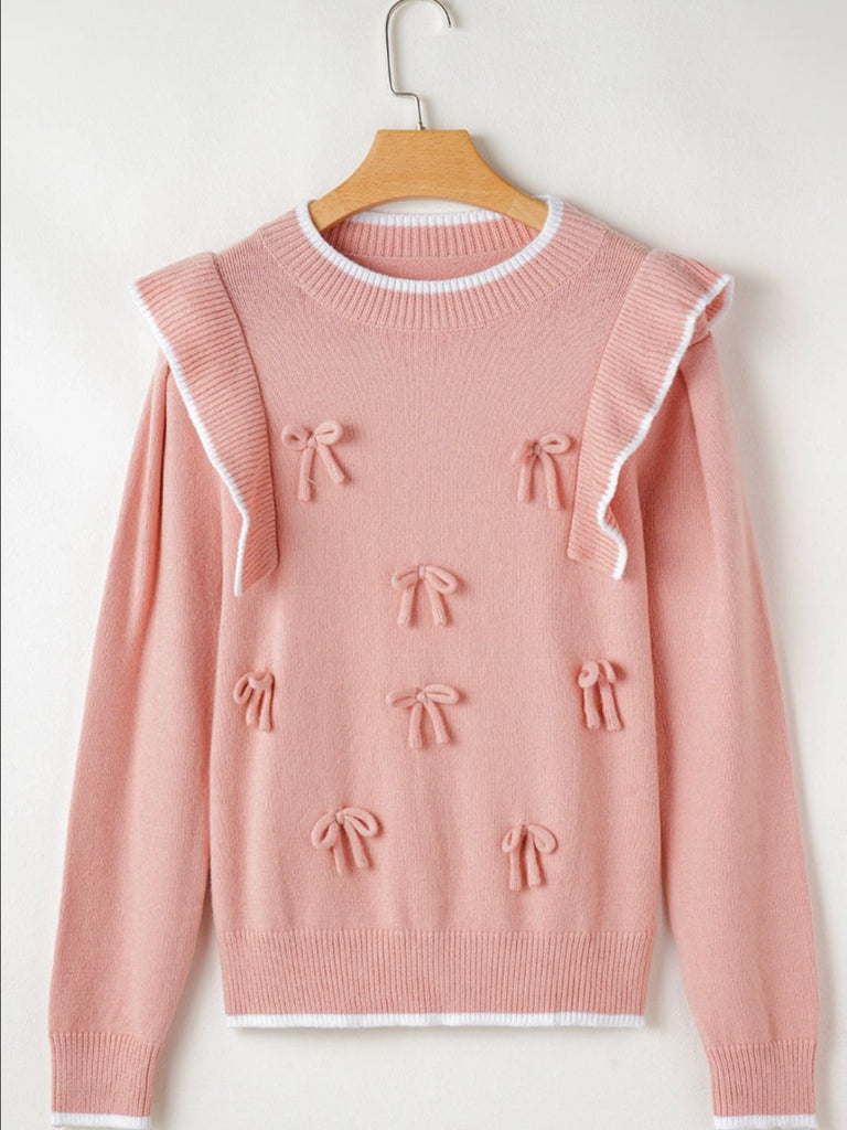  Pink colour with white trim Bows Sweater, featuring delicate ruffle accents  and an adorable bowknot detail.