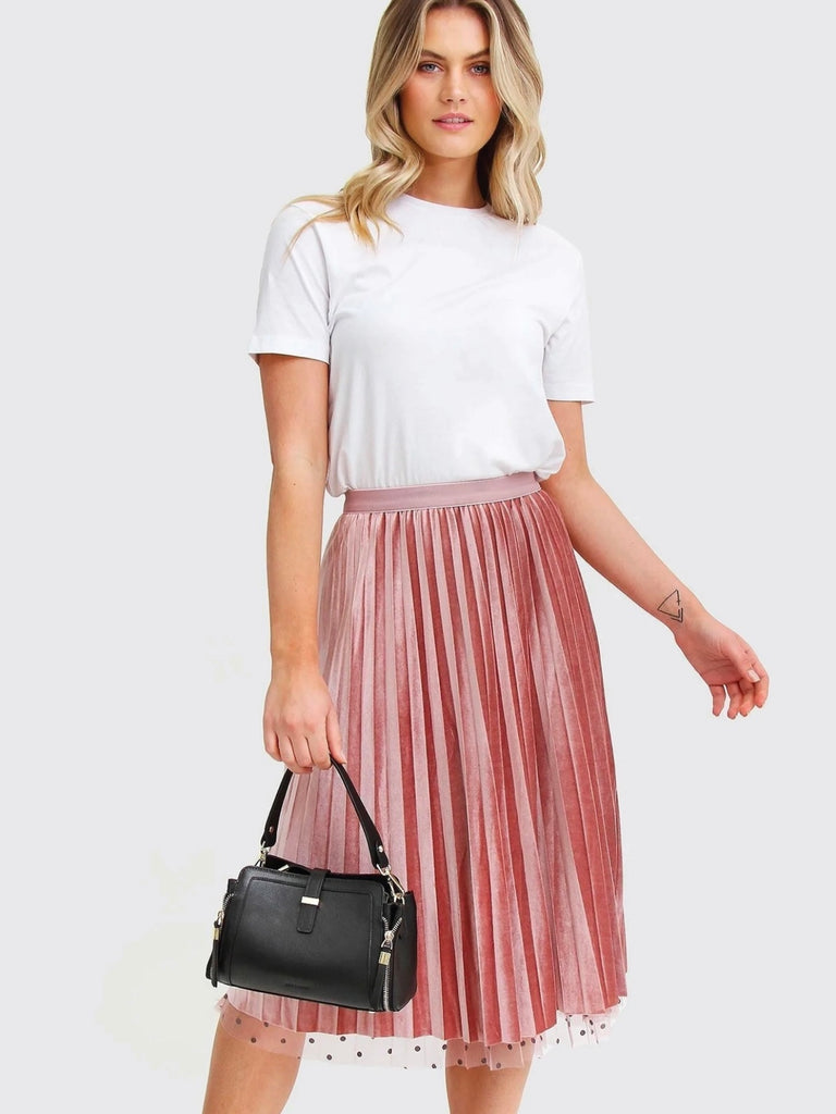 Pink Reversible Skirt, with two stunning looks in one: luxurious velour pleats on one side for an elegant touch, and playful polka-dotted tulle on the reverse side, and features a flared cut and elastic waistband.