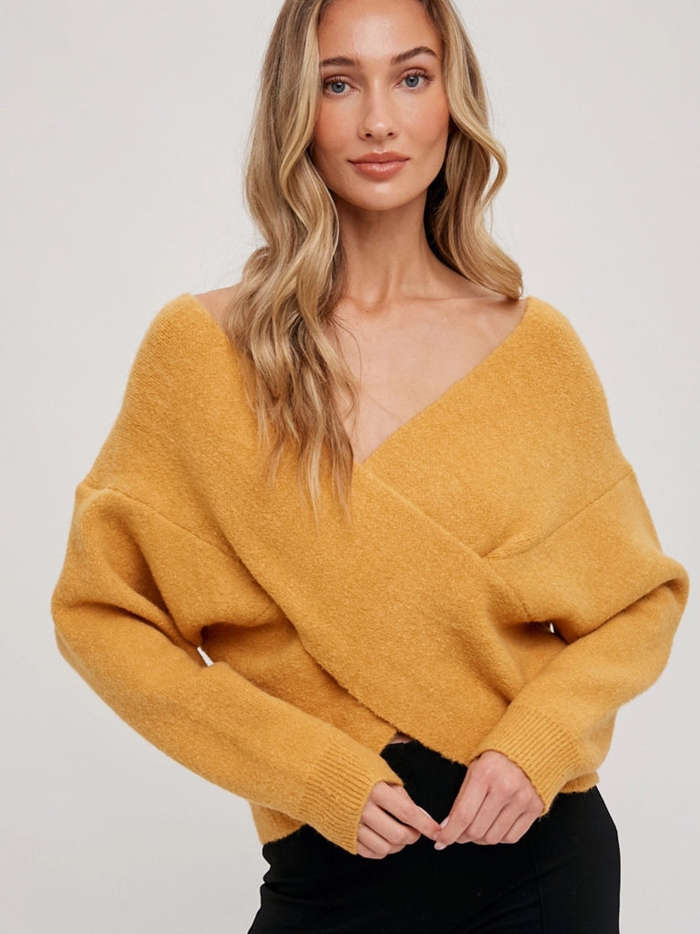 Golden drop-shoulder with flattering V-neckline wrap sweater.