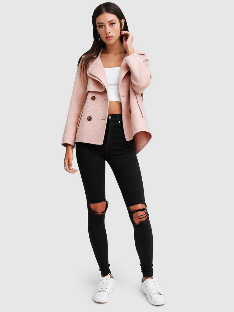 Pink Wool Blend Peacoat, featuring Oversized, cropped fit with large notch lapels, Double-breasted with flap side pockets and , eye-catching novelty buttons. 