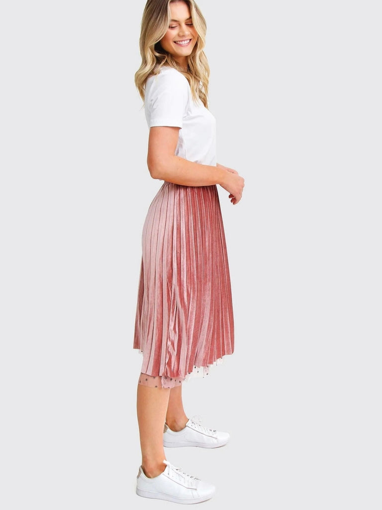 Pink Reversible Skirt, with two stunning looks in one: luxurious velour pleats on one side for an elegant touch, and playful polka-dotted tulle on the reverse side, and features a flared cut and elastic waistband.