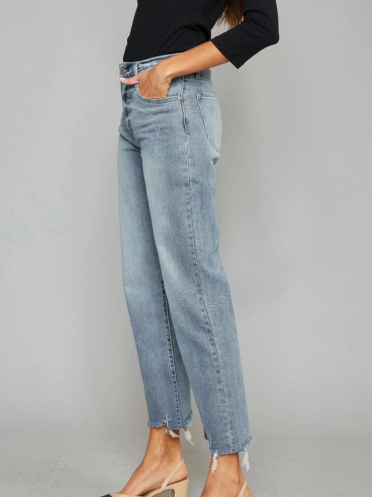 High Rise Slim Wide Leg Jeans lighter fading and whiskering, features a 5-pocket style , single front button closure, and zip fly with frayed hem.