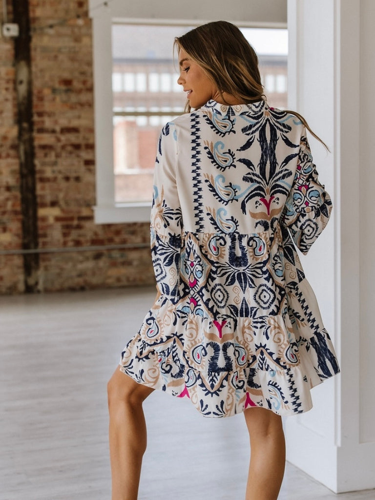 Trendy bracelet sleeves and buttoned design Tunic Dress , Featuring a vibrant blue and magenta tribal print.