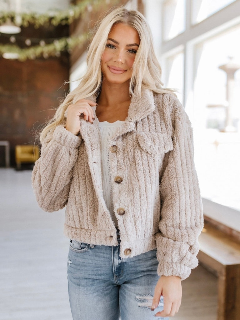  Fluffy oversized, loose fit Jacket with a thick plush ribbed fabric in a khaki colour, features front pockets and button front.