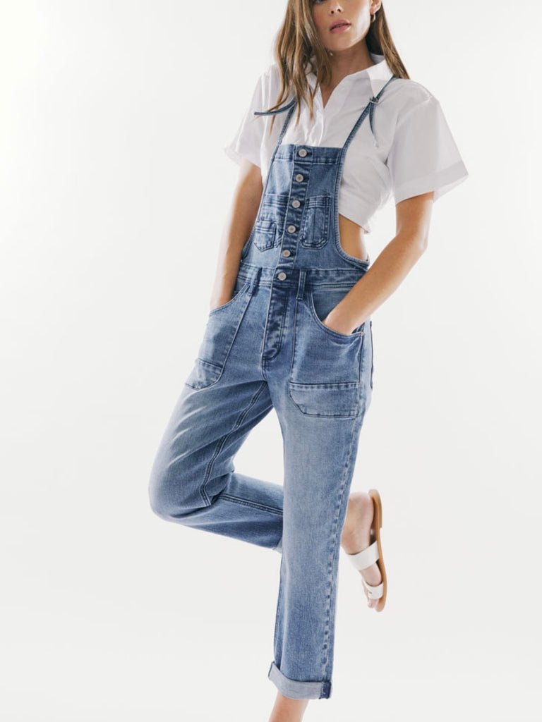 Tinsley Straight Leg Overalls come in a trendy distressed light or medium wash denim, complete with ample pockets. Featuring a button-up front and charming tie straps.