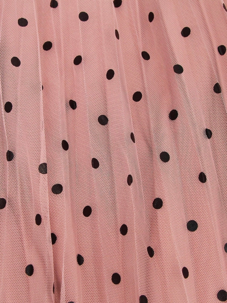 Pink Reversible Skirt, with two stunning looks in one: luxurious velour pleats on one side for an elegant touch, and playful polka-dotted tulle on the reverse side, and features a flared cut and elastic waistband.