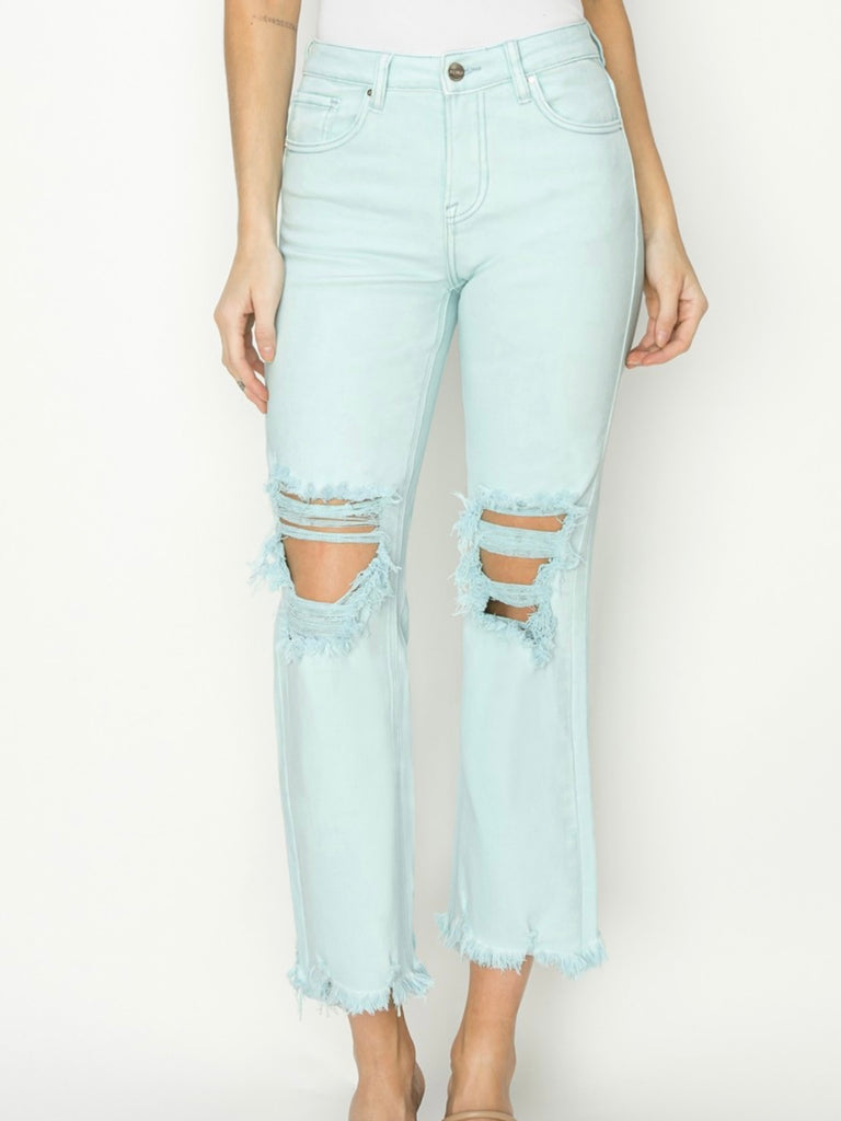 Mint cropped high rise, knee-length straight pants with distressing.