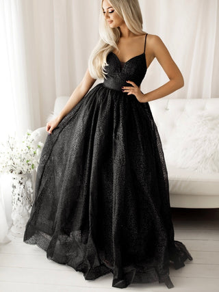 Champagne Gown in Black ,  with its stunning silhouette, that has a tied back and full skirt . 