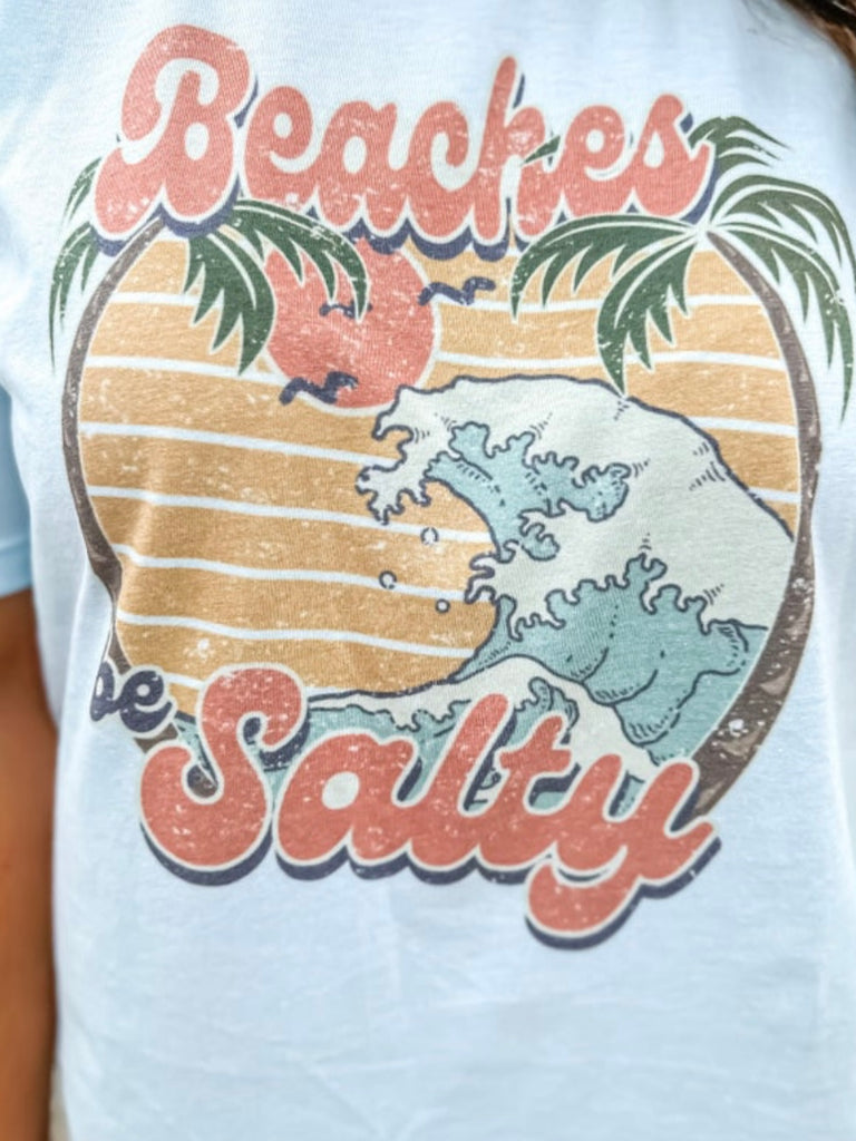 Salty Beaches Graphic on front of T-shirtMade with a 40/60 polyester-cotton blend.