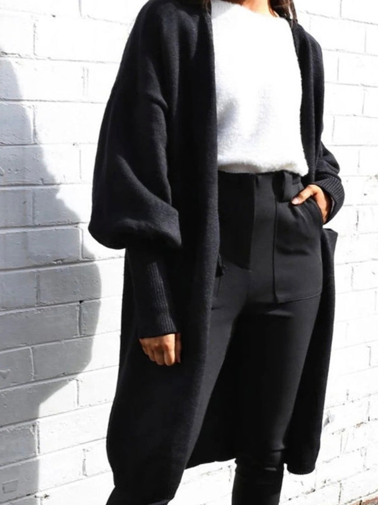  Solid black Bubbling Over Cardigan with Unique Bubble Sleeves and a Soft & Stretchy Fabric with a Longline Fit.