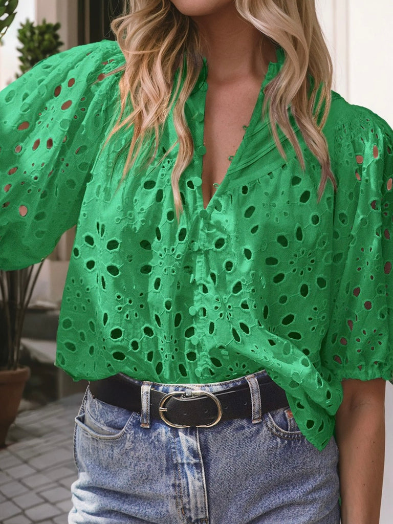 Green Hollowed Eyelet Blouse with delicate flower embroidery, puff sleeves and buttoned neckline.