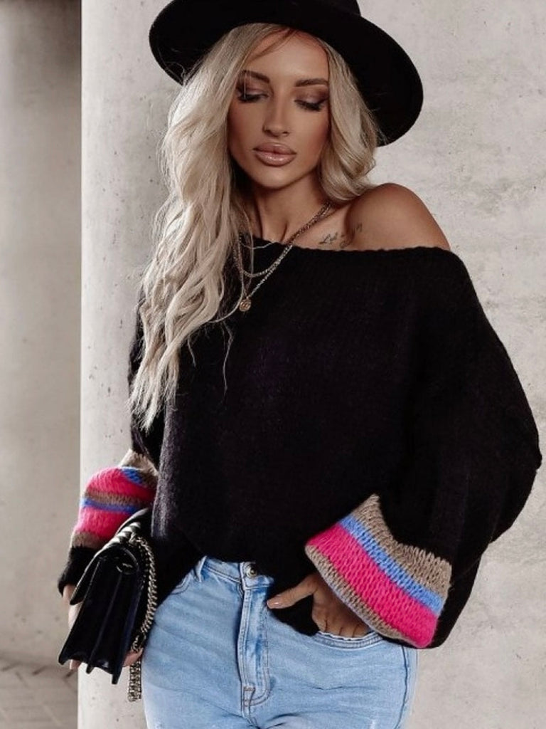 Knitted casual top with its round boat neckline, allover black with pink and blue contrast striped detailing on the sleeves, and balloon-style long sleeves and cuffs. Soft and stretchy, it's available in multiple colors.