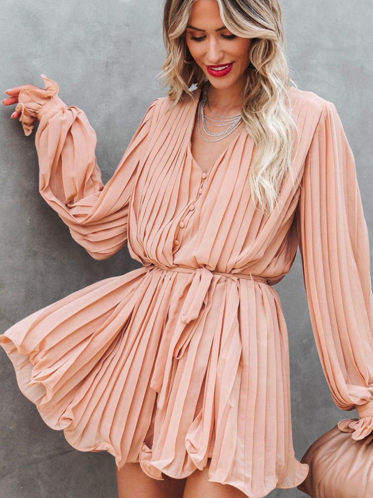  Playful V-neck Pink  Pleated Romper Dress features a tie waist With a buttoned front.