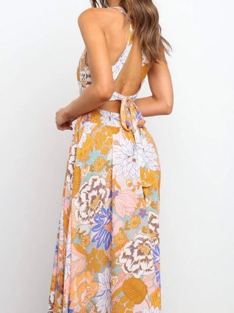 Floral print and sleeveless halter style tie, open back, maxi dress.