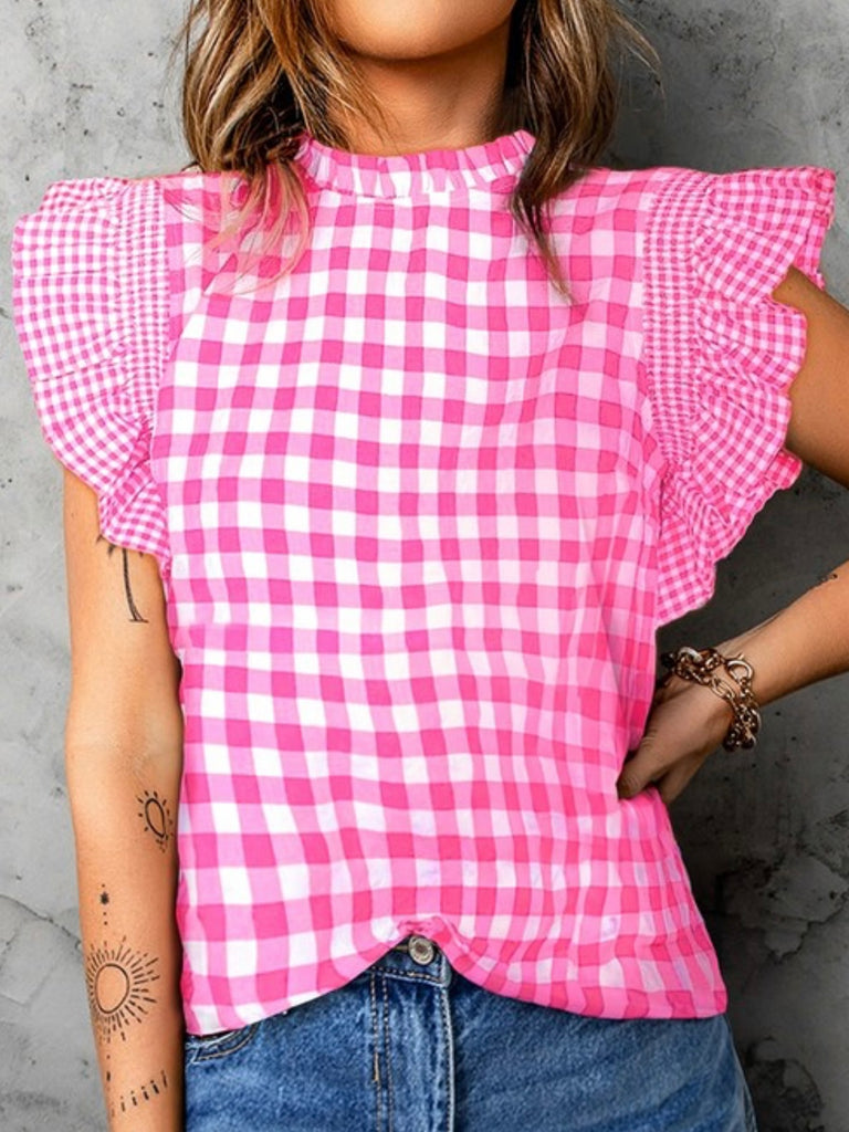  Pink Gingham Top Features  a charming ruffled cap sleeve and frilled neckline.