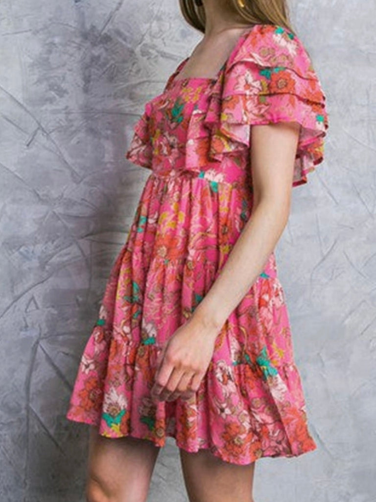 Ruffle Sleeve and tiered design , peachy pink colour dress with floral print and low square neck.