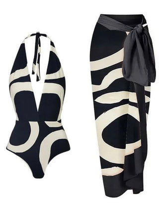 One -piece swimwear features a bow tie and a halter style unique irregular circle print in black and creamy white, comes with a chiffon wrap cover with a Bow Tie at waist.