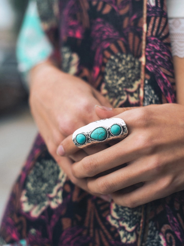 Unique design features a droplet-shaped turquoise stone nestled in a 60/40 zinc alloy and stone ring. Perfect for sizes 5-8.