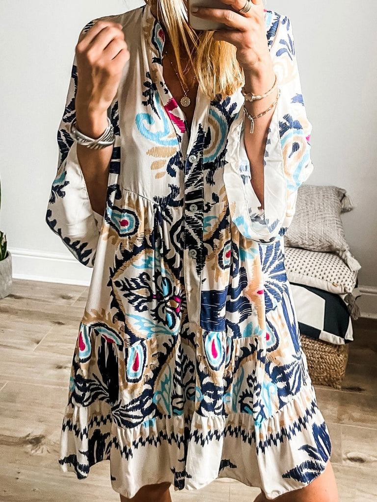 Trendy bracelet sleeves and buttoned design Tunic Dress , Featuring a vibrant blue and magenta tribal print.