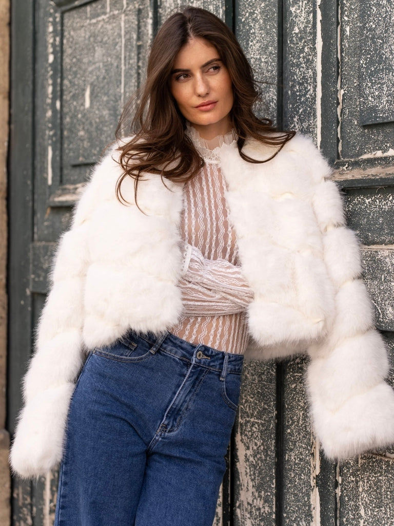 White  , Short faux- fur jacket features soft faux fur with a sleek, diagonal seam , and front button closure for easy fastening. 