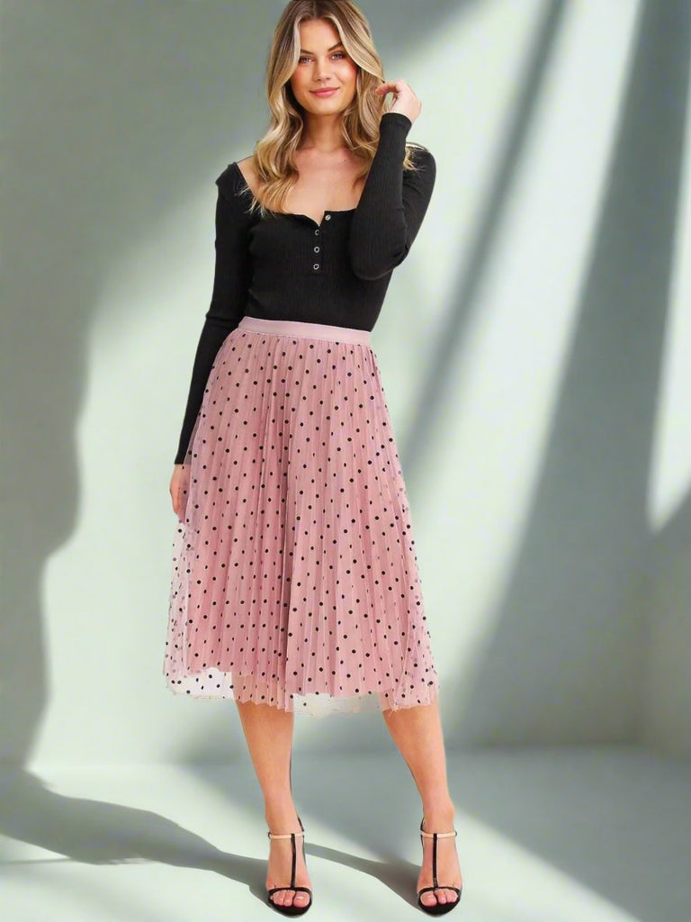 Pink Reversible Skirt, with two stunning looks in one: luxurious velour pleats on one side for an elegant touch, and playful polka-dotted tulle on the reverse side, and features a flared cut and elastic waistband.