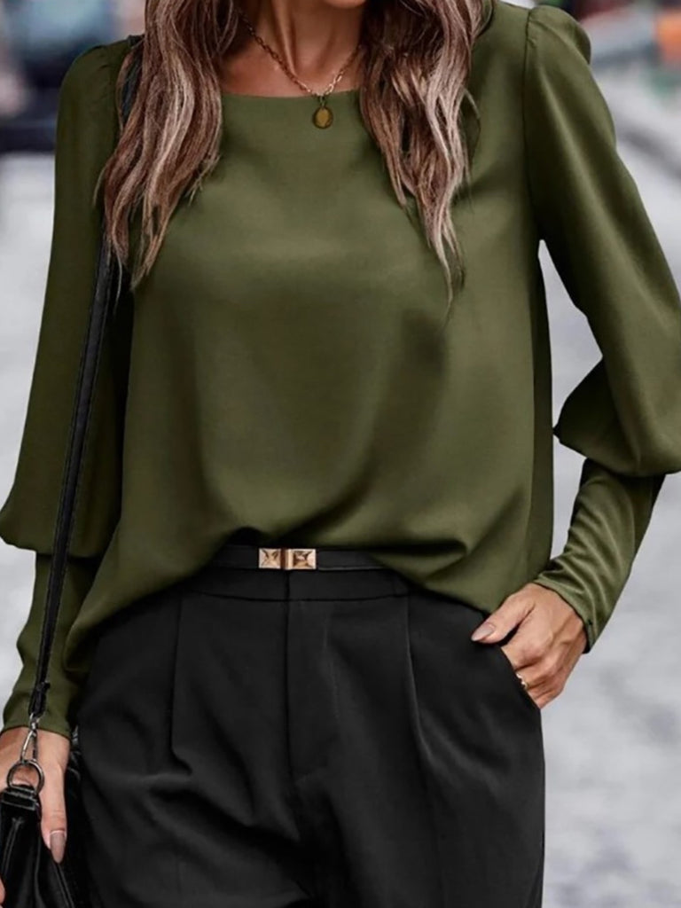 Olive -Green puffed sleeved blouse with back button detail.