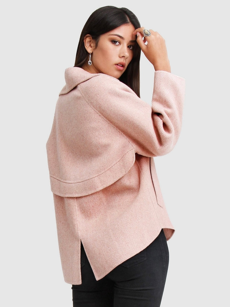 Pink Wool Blend Peacoat, featuring Oversized, cropped fit with large notch lapels, Double-breasted with flap side pockets and , eye-catching novelty buttons. 