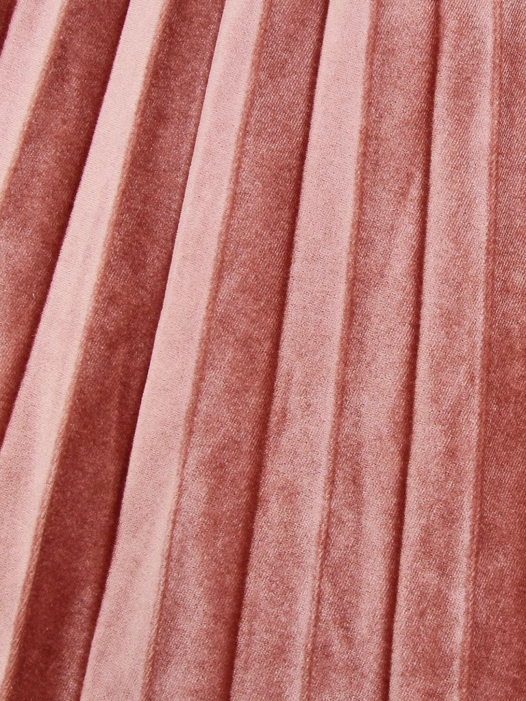 Pink Reversible Skirt, with two stunning looks in one: luxurious velour pleats on one side for an elegant touch, and playful polka-dotted tulle on the reverse side, and features a flared cut and elastic waistband.