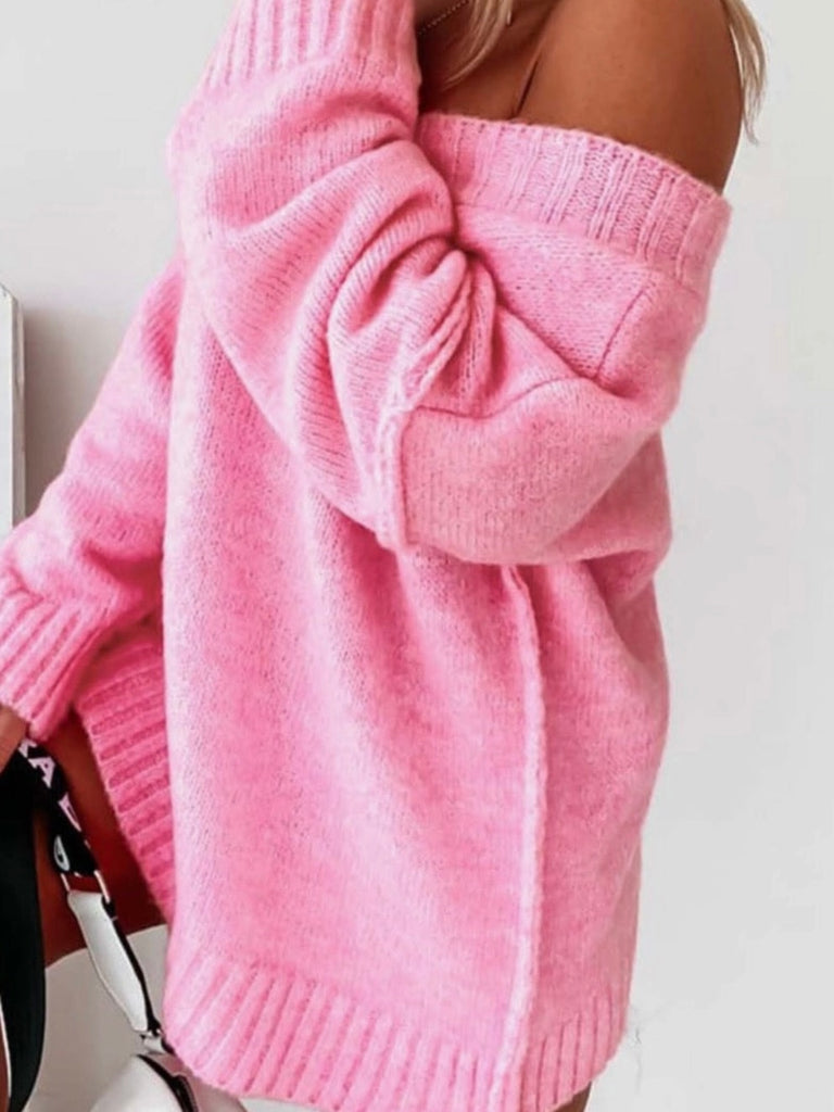 Pink oversized sweater features a stylish V-neck and dropped shoulder , it also has wide ribbed trim and exposed seams