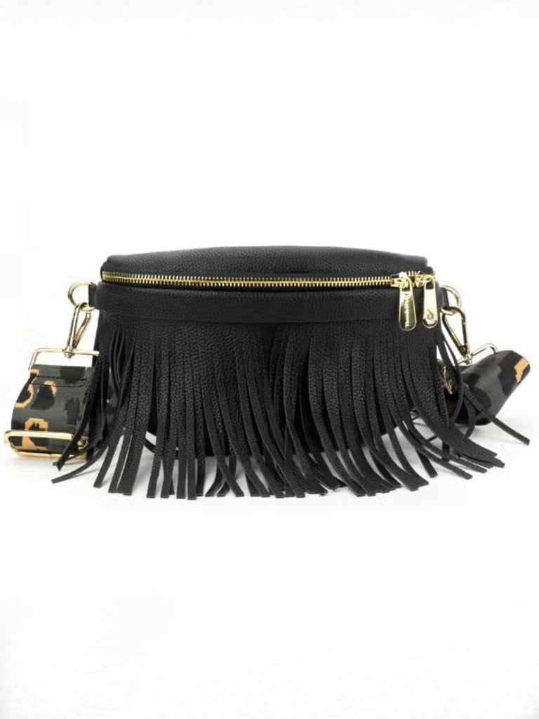 Black vegan leather compact crossbody featuring gold hardware, a tassel zipper top with an interior zipper pocket and adjustable strap 