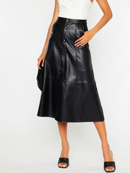  Black Faux -Leather Skirt features a high waistline, Exposed Snap Button Closure, the length of the skirt falls to the floor, and has handy pockets.