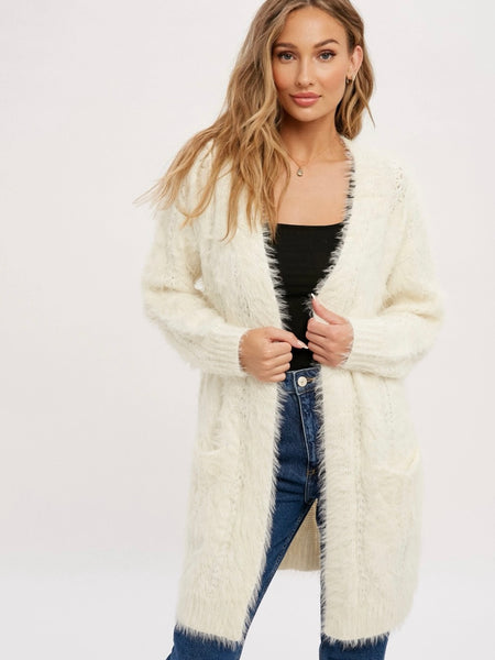 Fuzzy Cable Cardigan Sweater features charming cable details, an open front, and ribbed hem & cuffs for a relaxed fit.