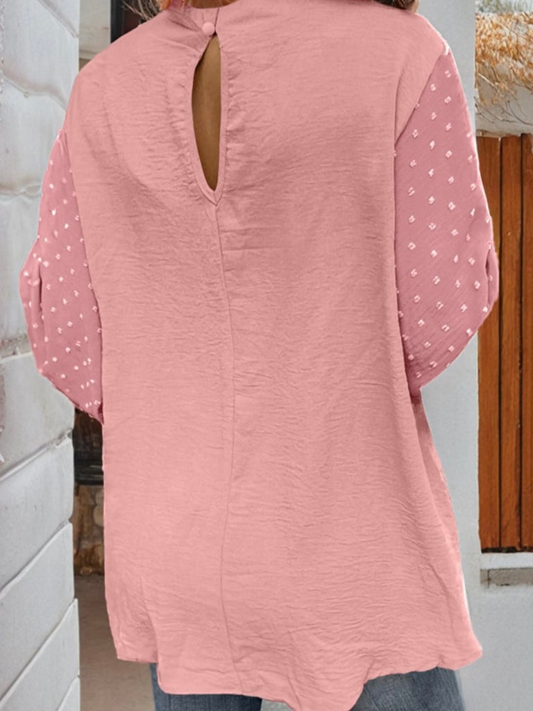 Pink , Balloon Sleeve Top, with a Contrasting Swiss Dot Pattern, and Elegant Keyhole Detailing. The stylish keyhole opening and dainty gold button closure on the back provide a chic finish. 