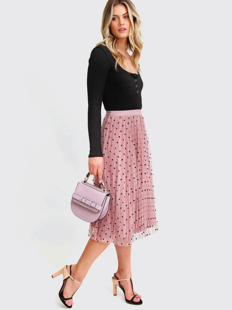 Pink Reversible Skirt, with two stunning looks in one: luxurious velour pleats on one side for an elegant touch, and playful polka-dotted tulle on the reverse side, and features a flared cut and elastic waistband.