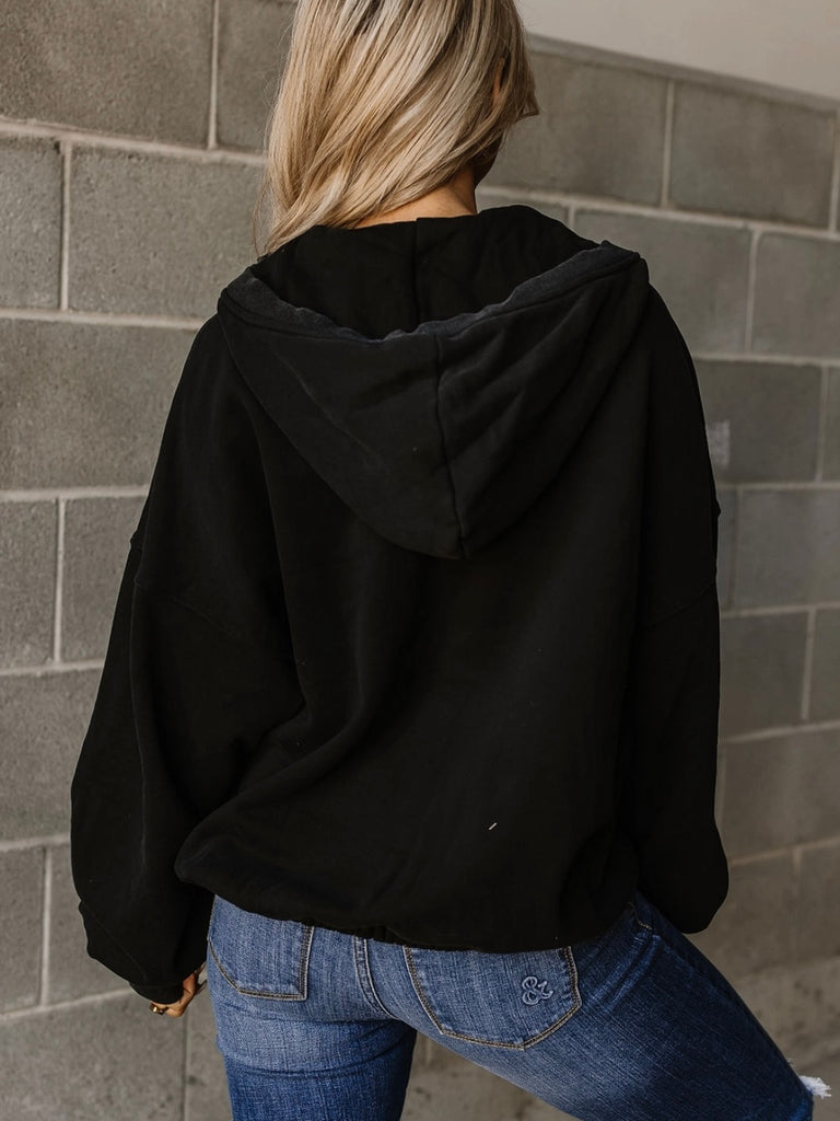 Black Coloured , Oversized Half - Zip Kangaroo Pocket with elastic hem, make this the perfect Hoodie.