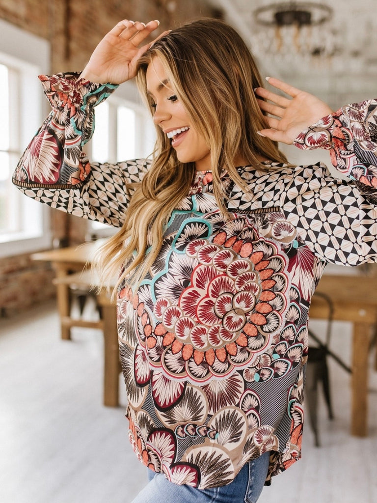 Vibrant floral print top,Crafted from 100% polyester.