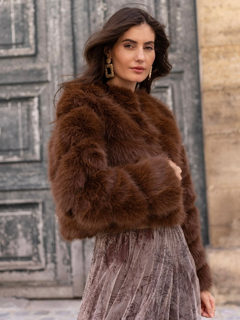 Brown , Short faux- fur jacket features soft faux fur with a sleek, diagonal seam , and front button closure for easy fastening. 