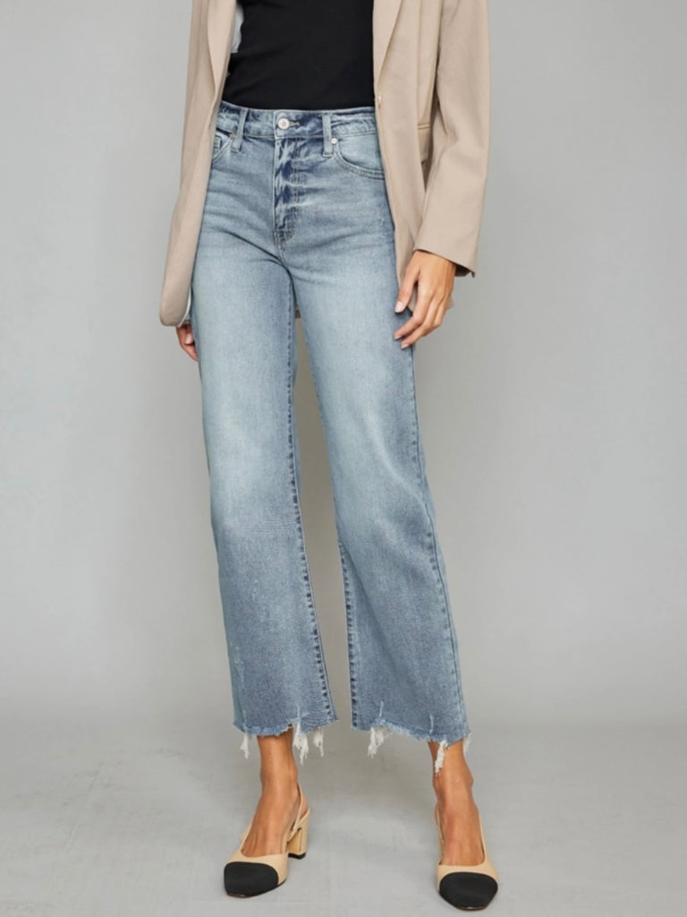 High Rise Slim Wide Leg Jeans lighter fading and whiskering, features a 5-pocket style , single front button closure, and zip fly with frayed hem.