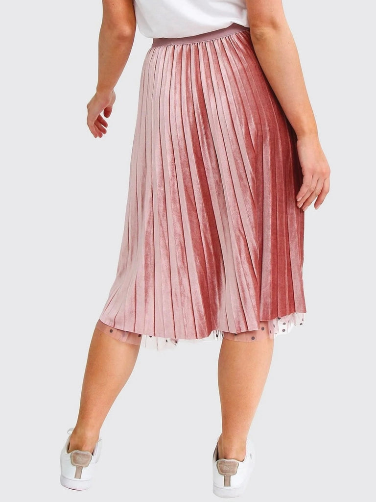 Pink Reversible Skirt, with two stunning looks in one: luxurious velour pleats on one side for an elegant touch, and playful polka-dotted tulle on the reverse side, and features a flared cut and elastic waistband.