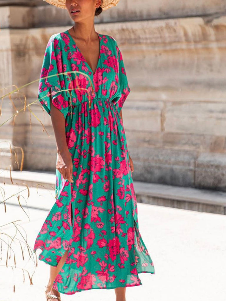 Sea Green hue and vibrant Pink Red floral print Maxi-Dress with a Flattering v-neck and flutter sleeves and slits at the hemline.