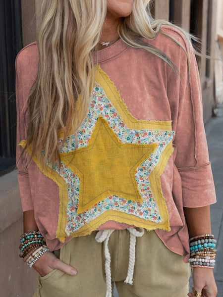  Star Front Top With a unique exposed-seam design and eye-catching floral star bust pattern, comes in Rose Tan.