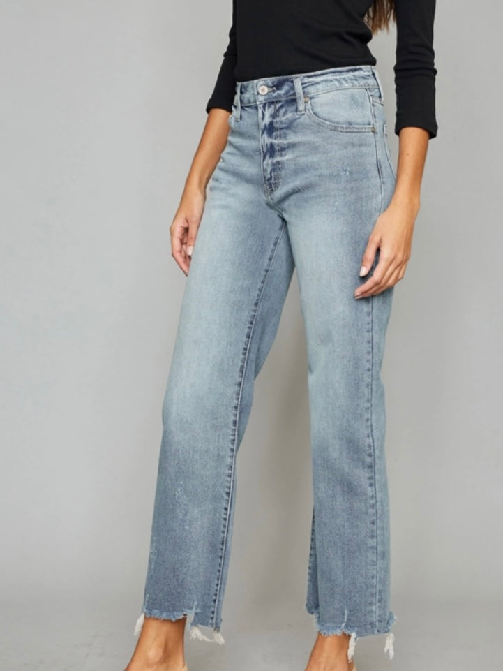 High Rise Slim Wide Leg Jeans lighter fading and whiskering, features a 5-pocket style , single front button closure, and zip fly with frayed hem.