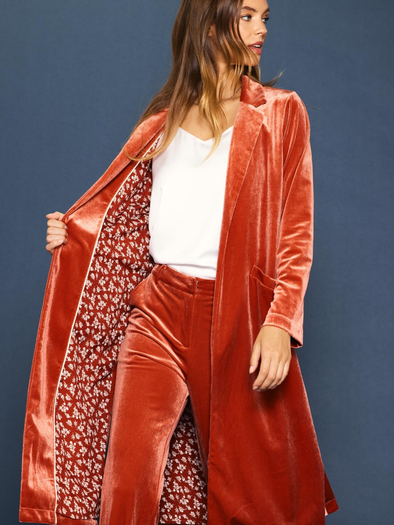 Terracotta velvet long duster coat. Front pockets and contrasting lining.