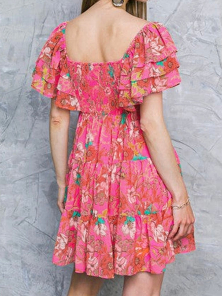 Ruffle Sleeve and tiered design , peachy pink colour dress with floral print and low square neck.