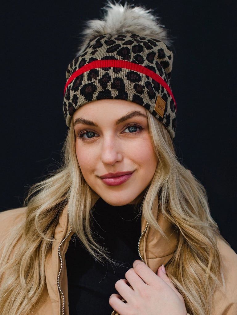 Leopard and red striped fleece lined faux pom hat.