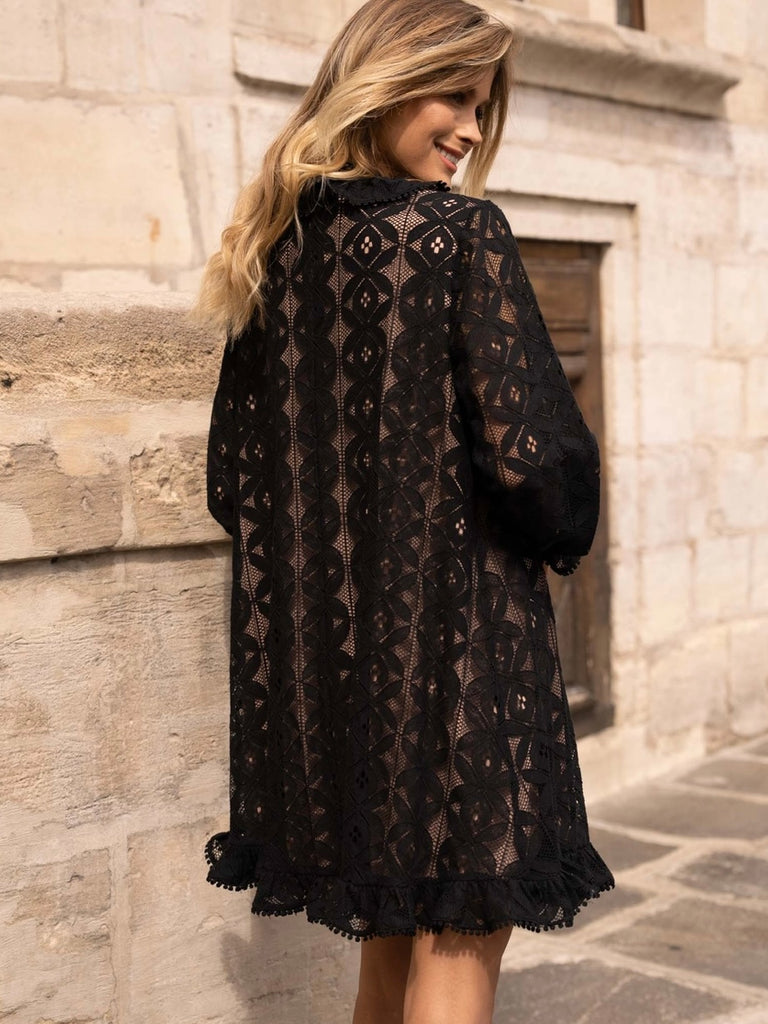 Black Lace Midi Dress featuring a frilly collar and buttons, long ruffle sleeves, and a flared cut with ruffle details at the bottom.