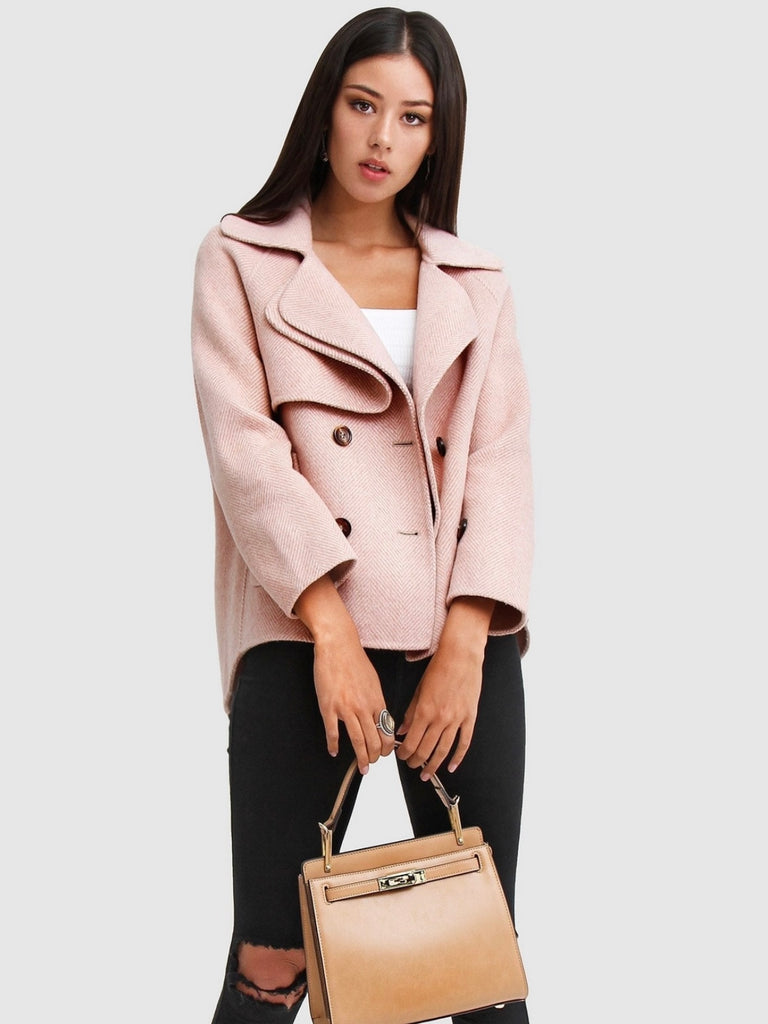 Pink Wool Blend Peacoat, featuring Oversized, cropped fit with large notch lapels, Double-breasted with flap side pockets and , eye-catching novelty buttons. 